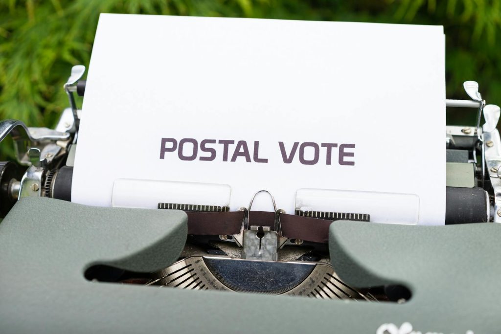 Paper With the Words Postal Vote in a Typewriter